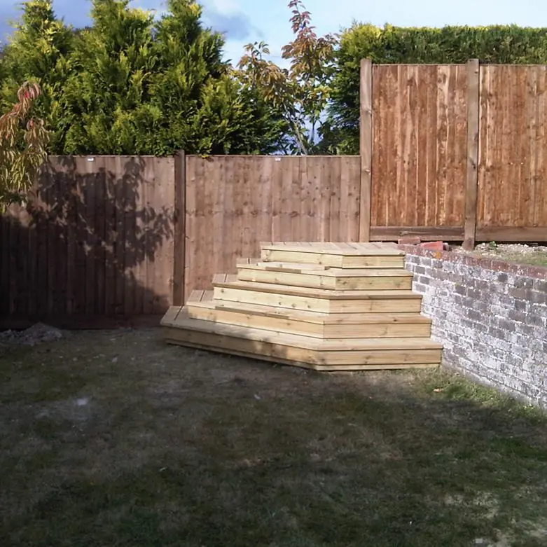 Steps between two garden levels, with removable sections to grow plants in